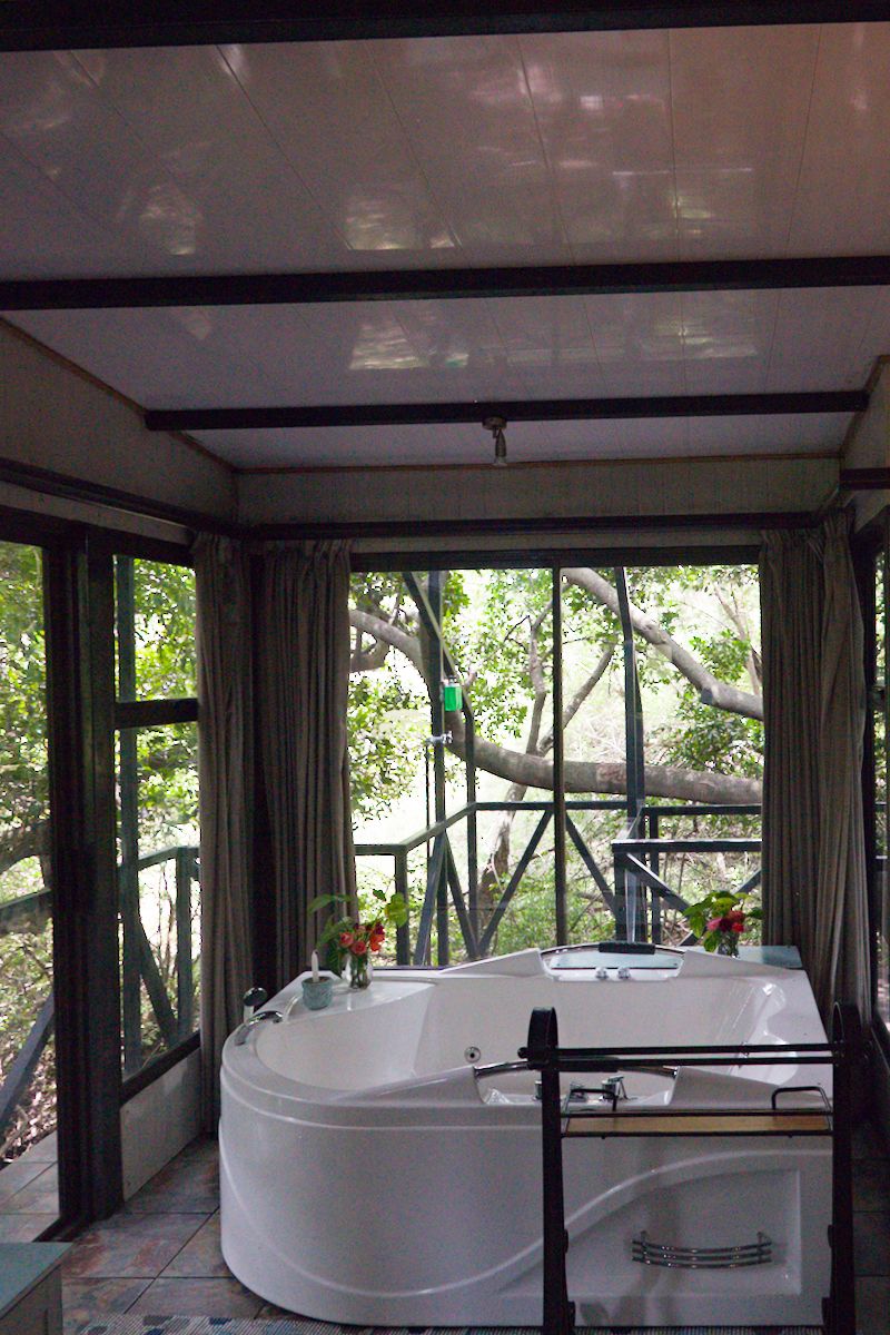 Spa bath at Tranquility Lodge surrounded by nature